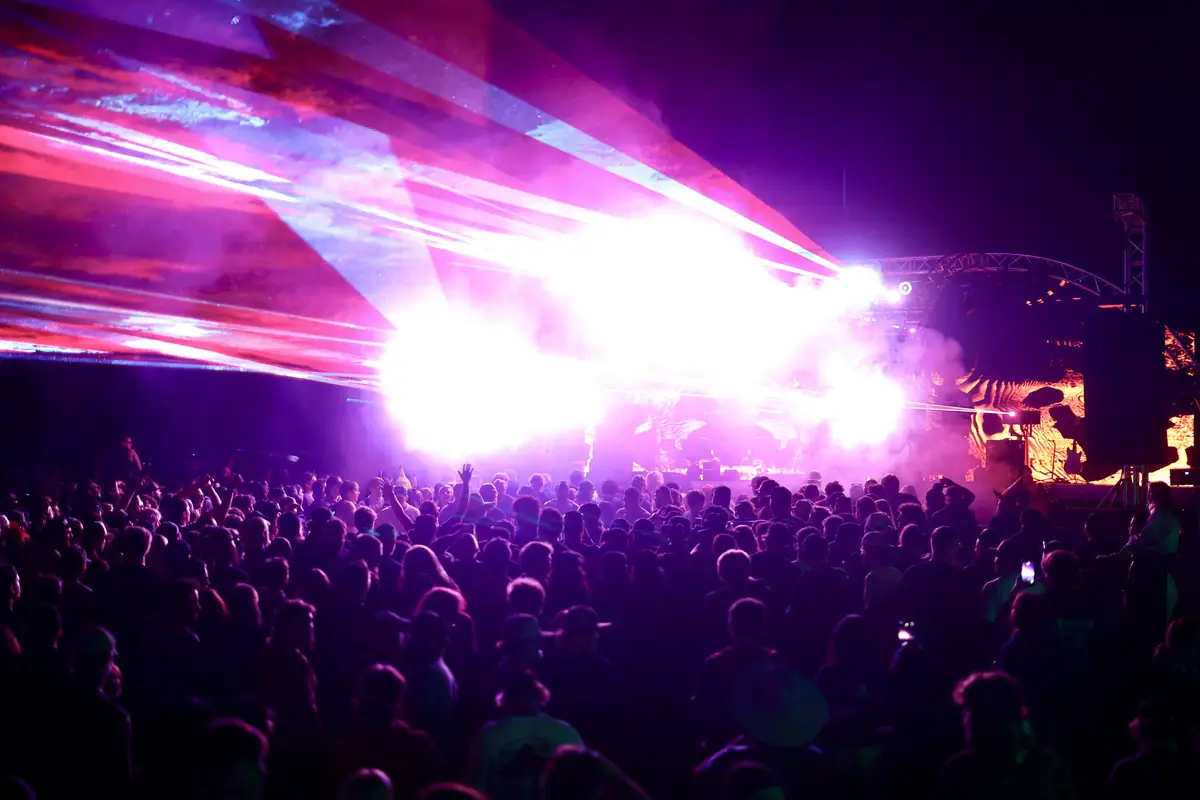 A crowd under the lights at a HyperFest night concert